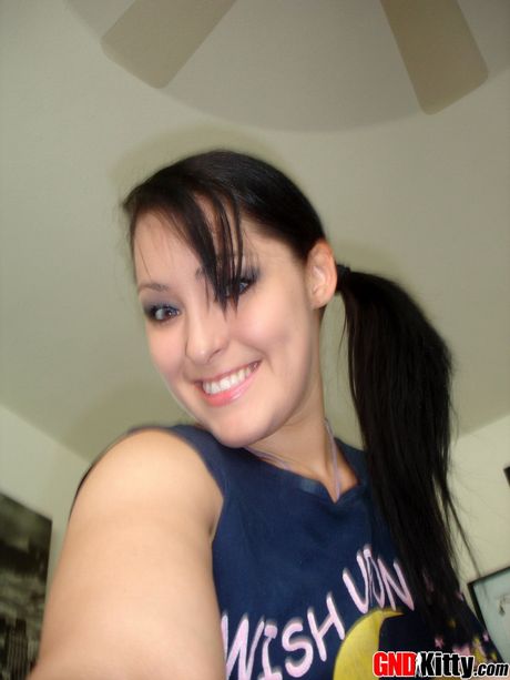 Asian teen Kitty strips and shows her big melons and ass in a solo